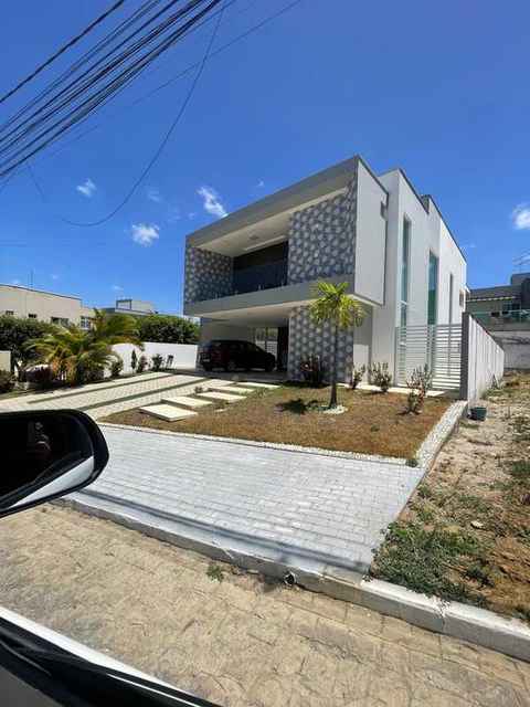 Residência duplex · Alphaville · Painéis geométricos e varanda em vidro